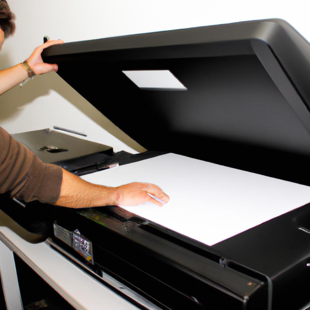 Person operating large format printer